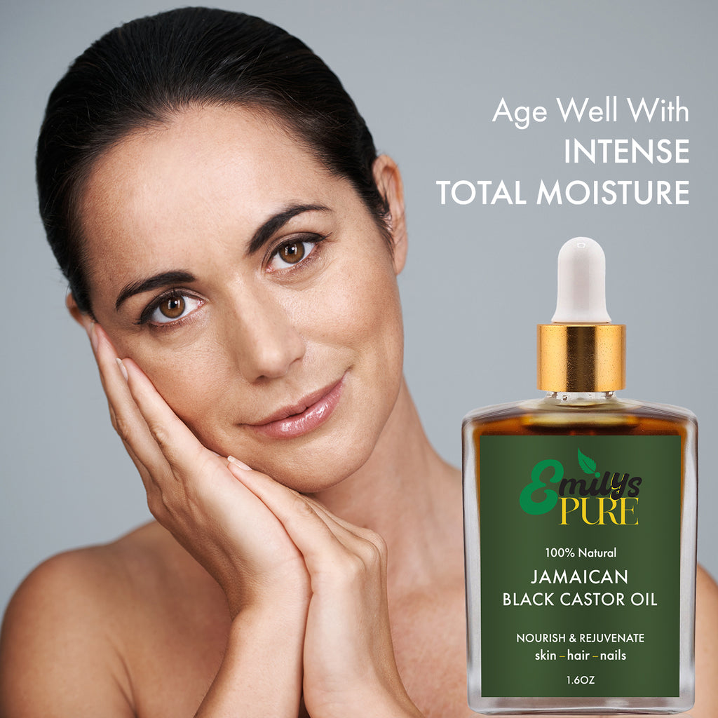 Mature Caucasian woman with a bottle of Emu's Pure Jamaican Black Castor Oil. Age well with intense total moisture.