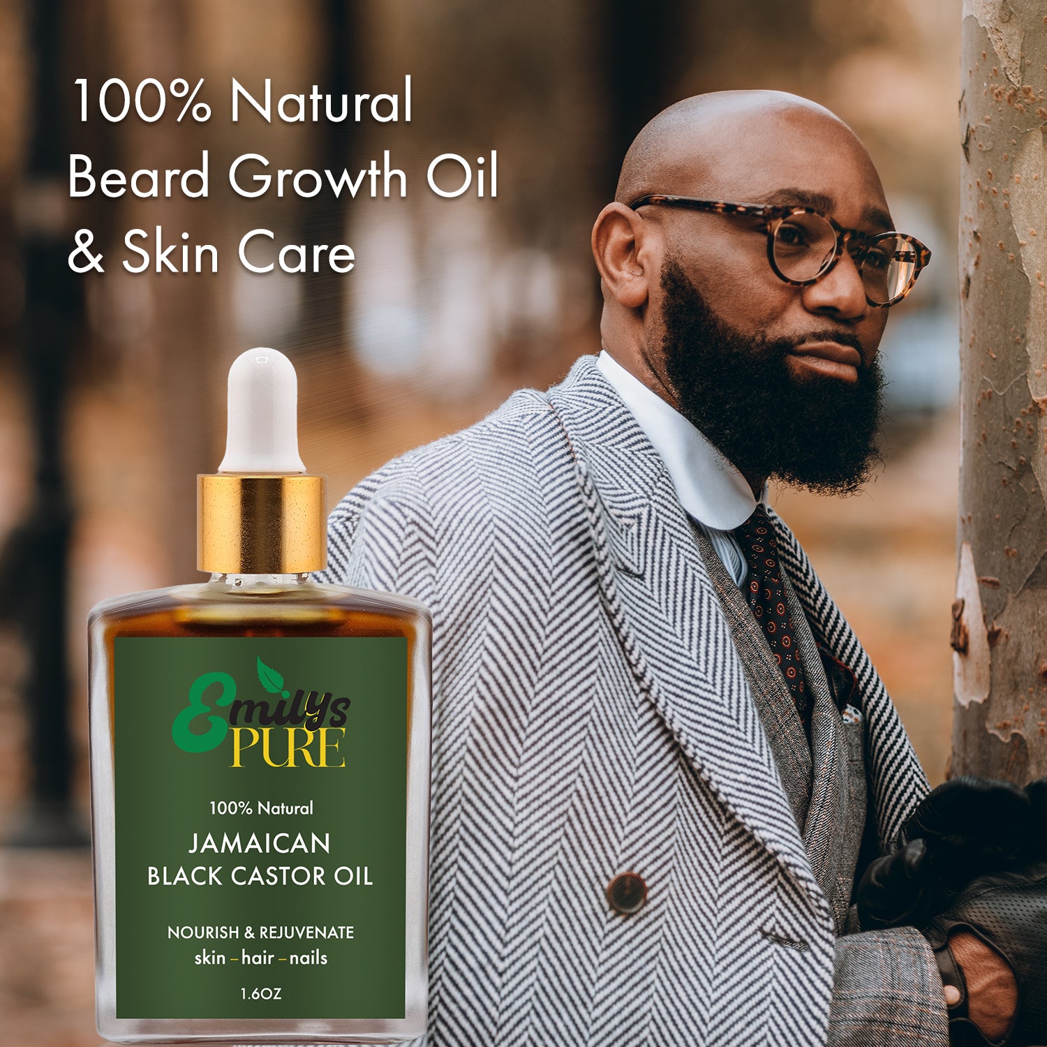 Man with a beard wearing glasses and a suit, a bottle of Emily's Pure Jamaican Black Castor Oil for Beard Growth, skin care