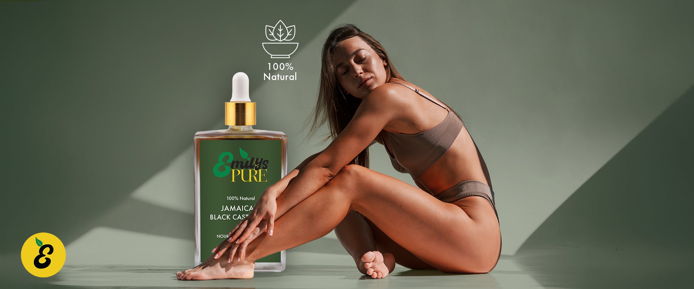 Woman in a brown bikini sitting next to a bottle of Emily's Pure Jamaica Black Oil represents total body care. 